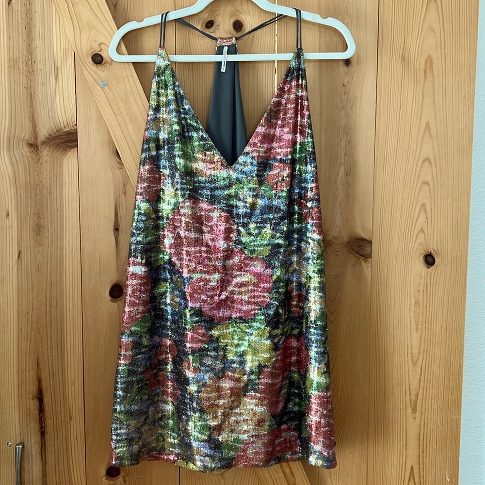 NWOT Free People mini dress. Floral pattern of sequins. Size M.